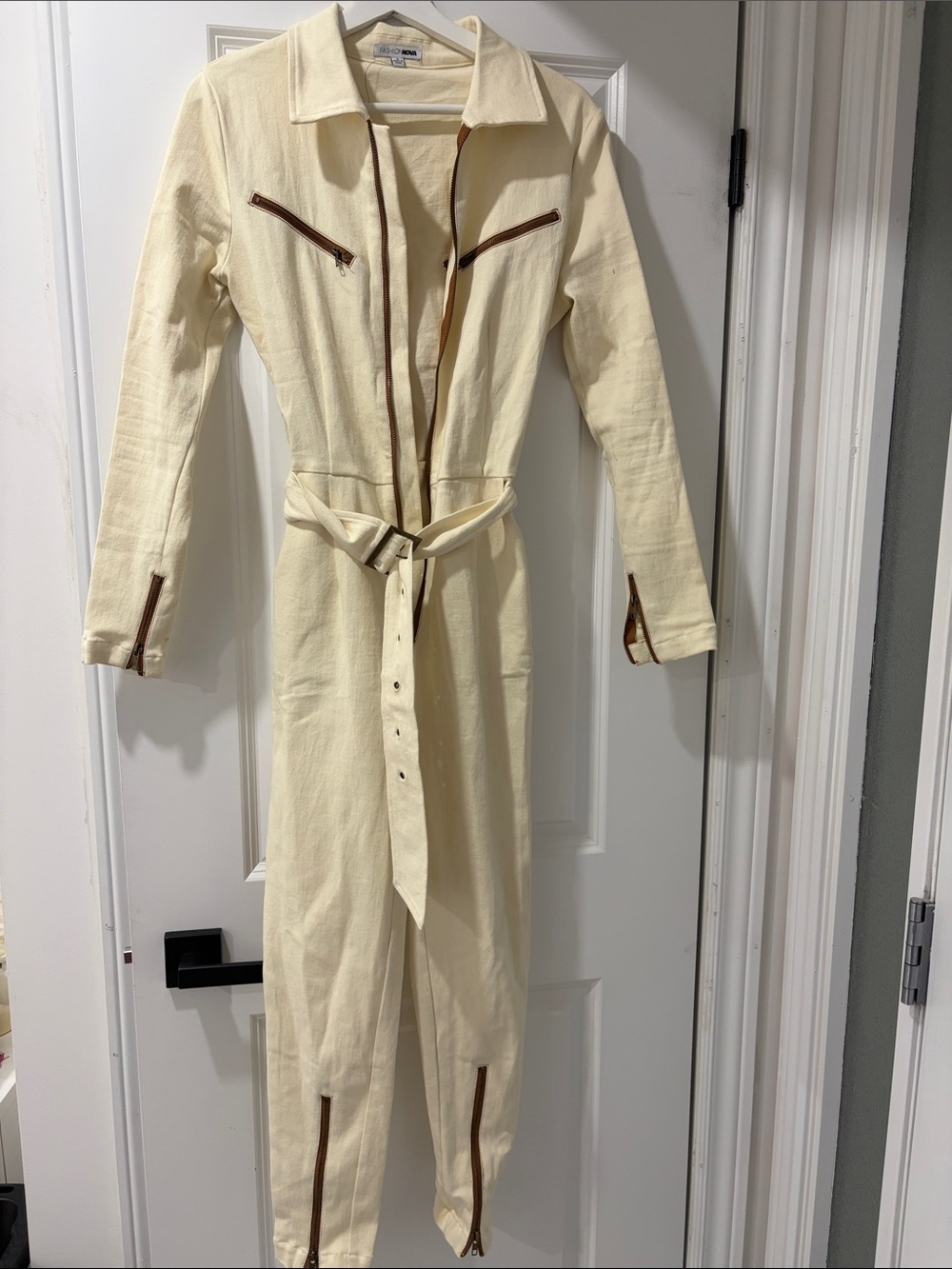 Fashion Nova Cream Long-Sleeve Belted Jumpsuit with Brown Trim
